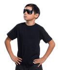 Boy wearing black Batman character eyes over his face