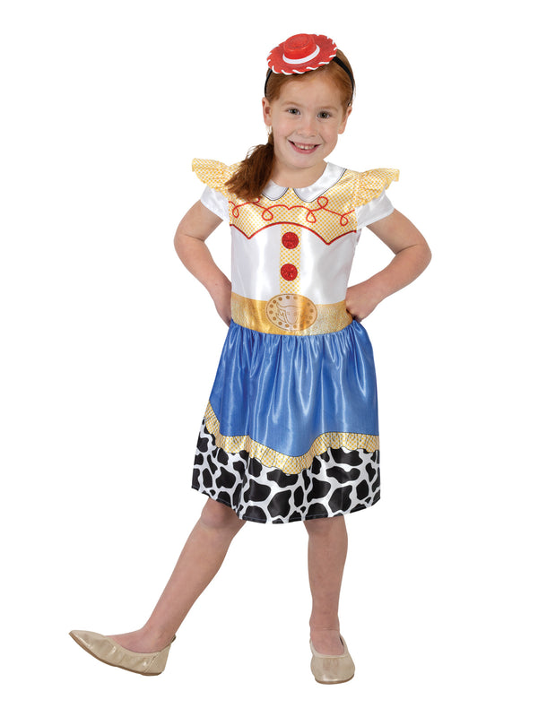 Girl in the Toy Story Jessie dress with a white and yellow top, blue skirt with cow print hem and red mini hat
