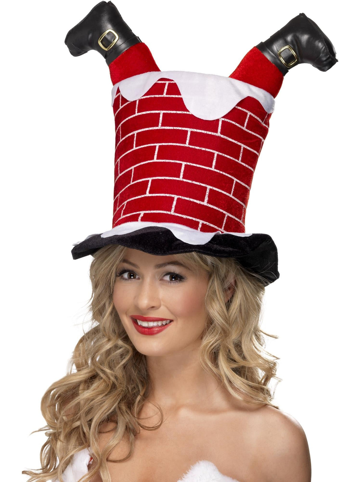 Woman wearing a red brick chimney hat with Santa's legs and black boots sticking out the top
