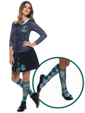 Woman wearing knee-high green and grey Slytherin socks with emblems