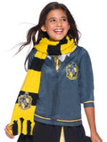 Girl wearing a yellow and black striped Hufflepuff knit scarf with house emblem