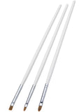 Three white-handled make-up brushes in different tip shapes
