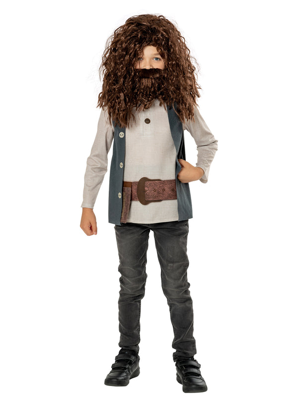 Boy in the Harry Potter Hagrid costume with a long curly brown wig and beard, cream tunic, waistcoat and belt