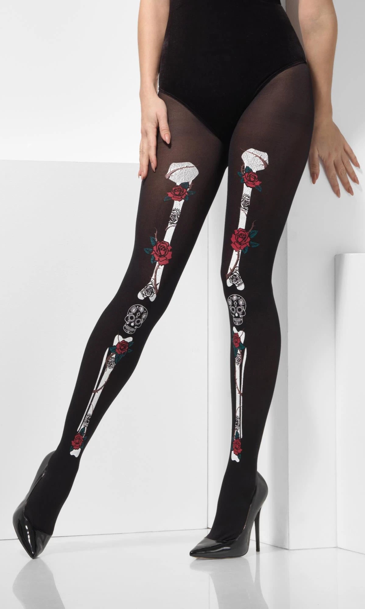 Legs wearing black Day of the Dead tights printed with skeleton bones and red roses