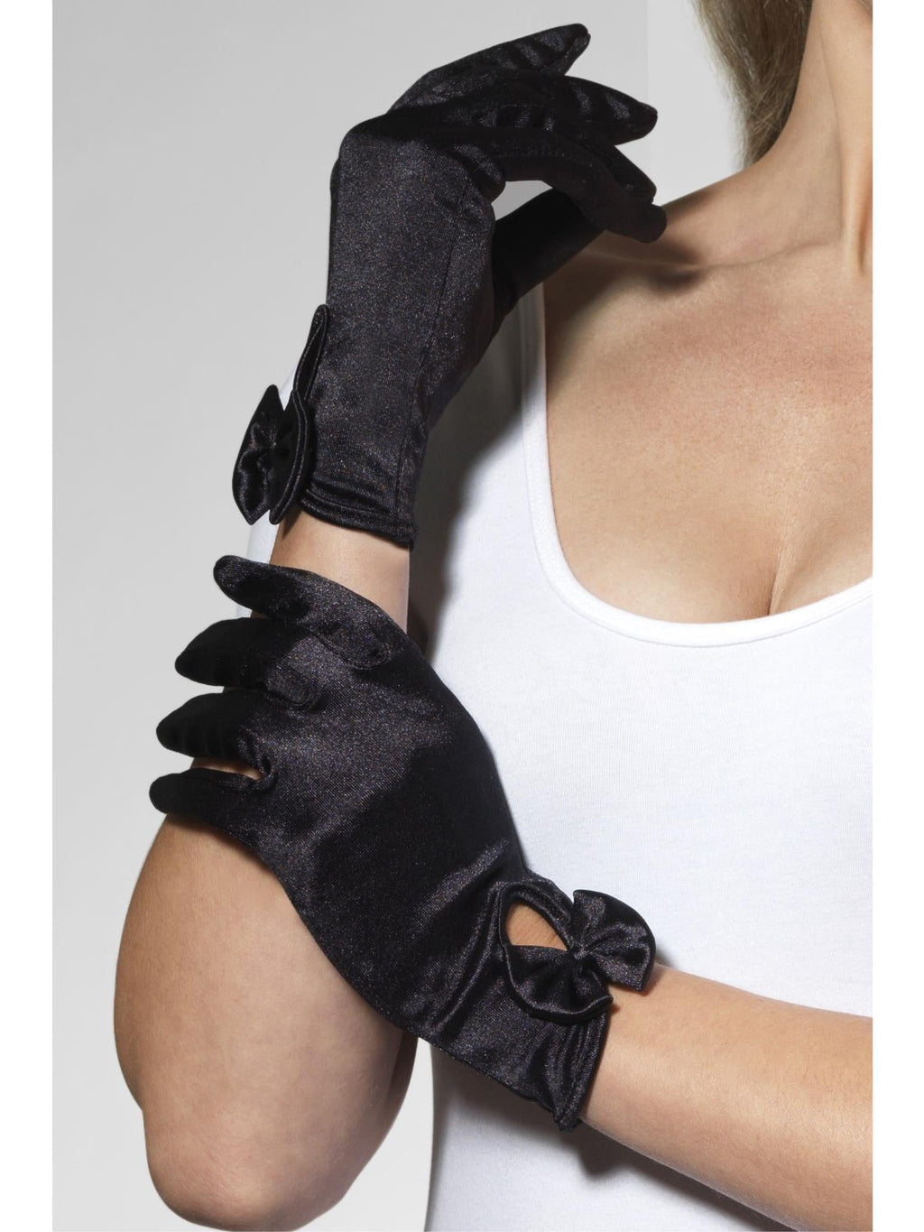 Hands wearing short black satin gloves with bows at the wrist