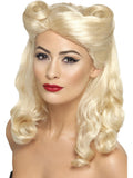 Woman wearing a long wavy blonde 40s pin-up wig with victory rolls