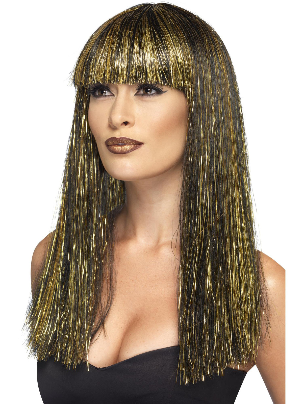 Woman wearing a long straight black Egyptian goddess wig with gold tinsel strands and fringe