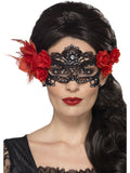 Woman wearing a black lace filigree Day of the Dead eyemask with red roses on each side