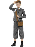 Boy wearing a grey WW2 evacuee jacket with mock shirt, 3/4 pants, brown cap and satchel with ID tag