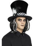 Man wearing a tall black velvet top hat with black and white checked band, feather and attached black and white hair