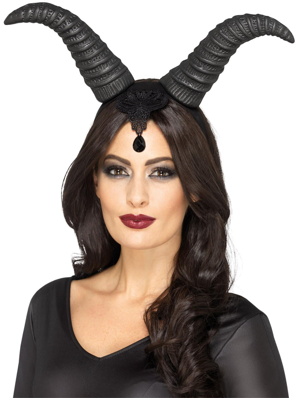 Woman wearing large curved black demonic queen horns on a headband with a black jewel