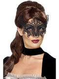 Woman wearing a black filigree lace swirl eyemask