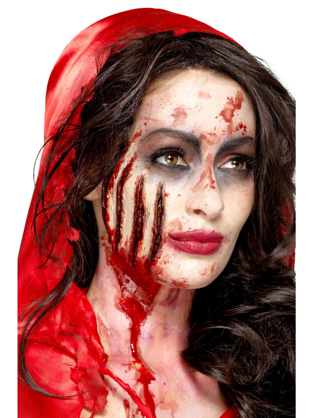 Woman wearing a bloody claw wound prosthetic across her cheek
