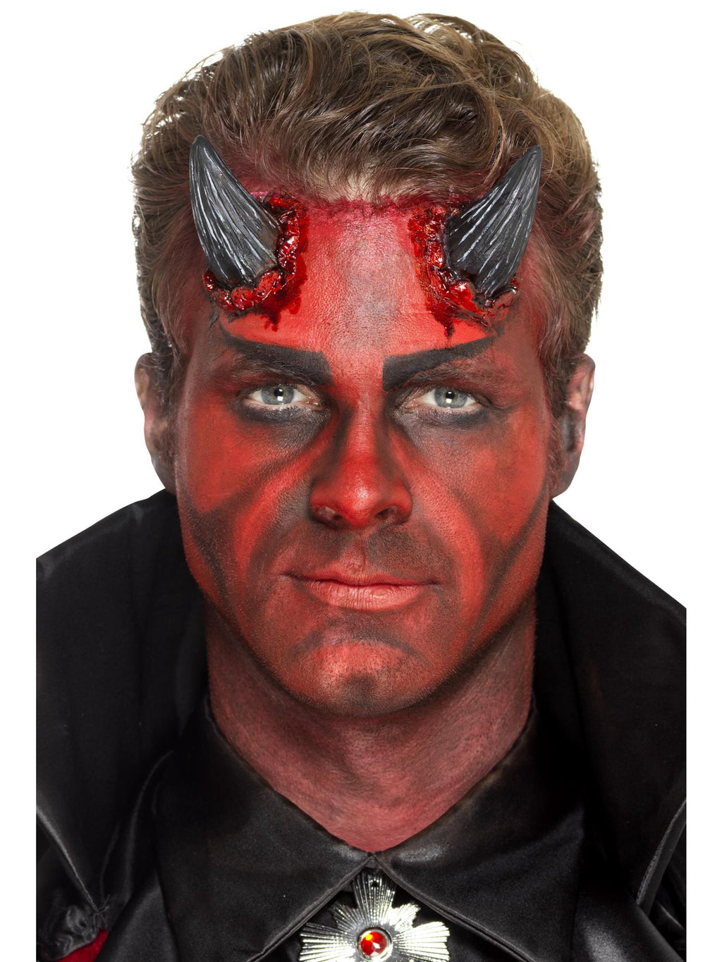 Man with red devil face paint wearing black latex devil horn prosthetics