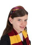 Girl wearing the maroon and gold striped Gryffindor headband