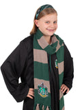 Girl wearing the striped Slytherin headband and green and grey knit scarf