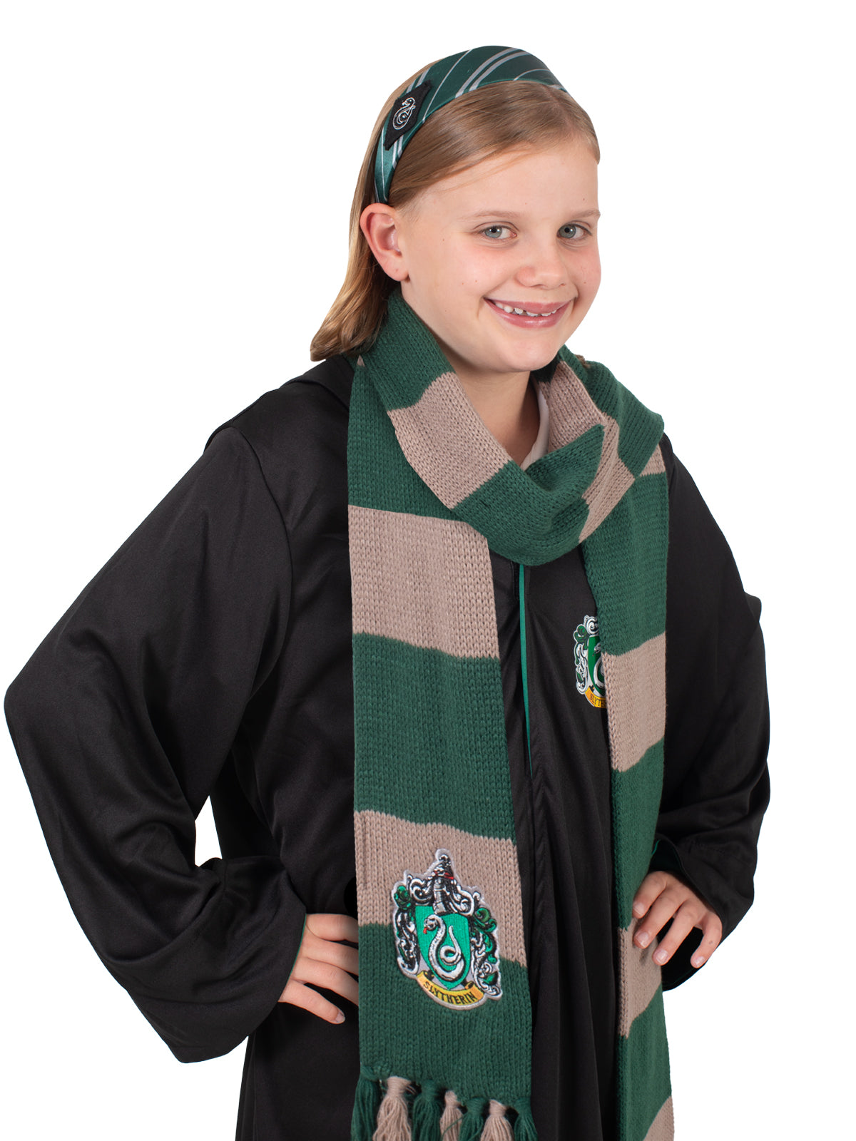 Girl wearing the striped Slytherin headband and green and grey knit scarf