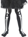 Child's legs wearing black tights with white skeleton bone print