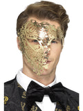 Man wearing a gold metal filigree phantom half-face mask