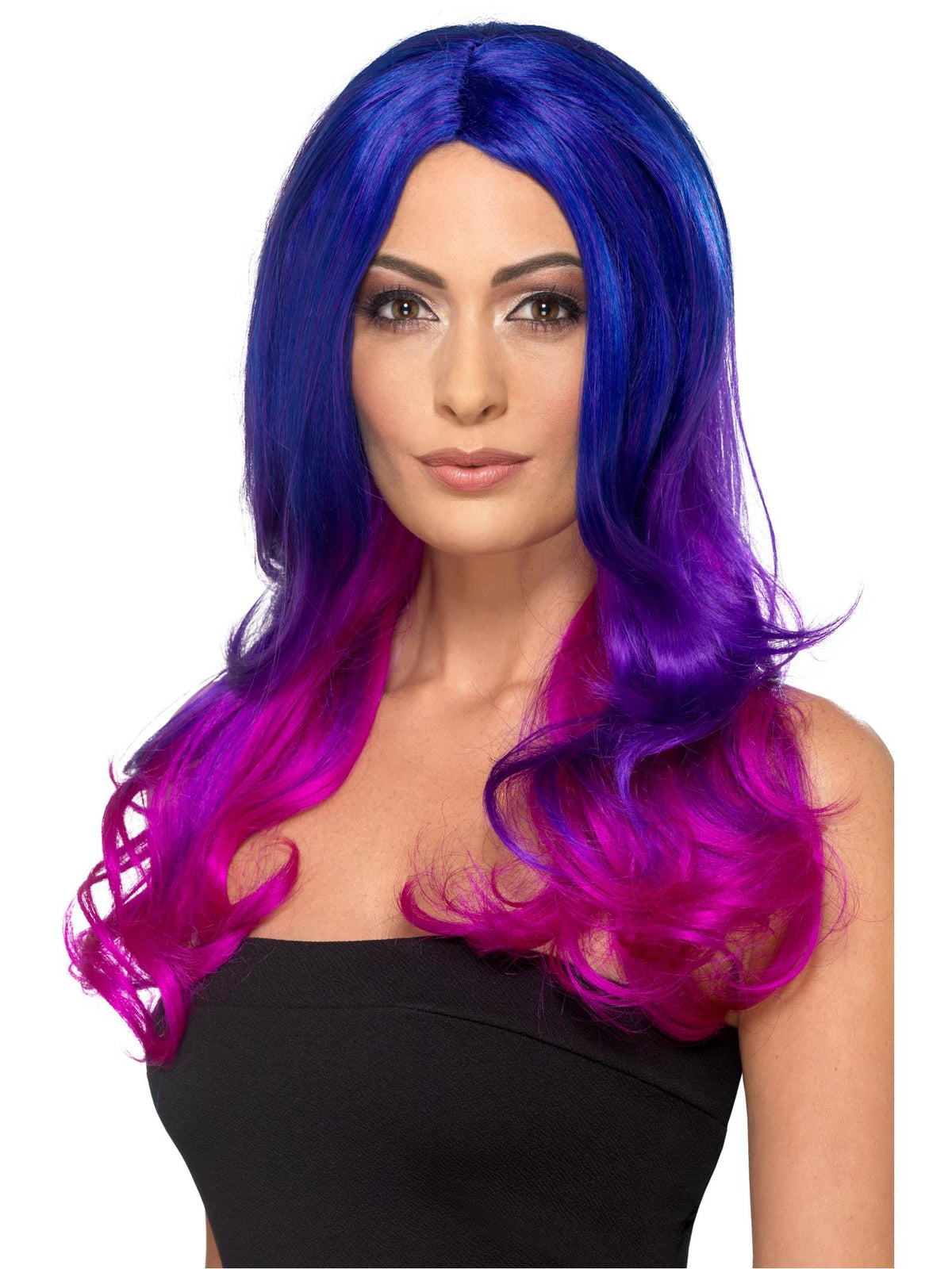 Woman wearing a long wavy blue to pink ombre wig