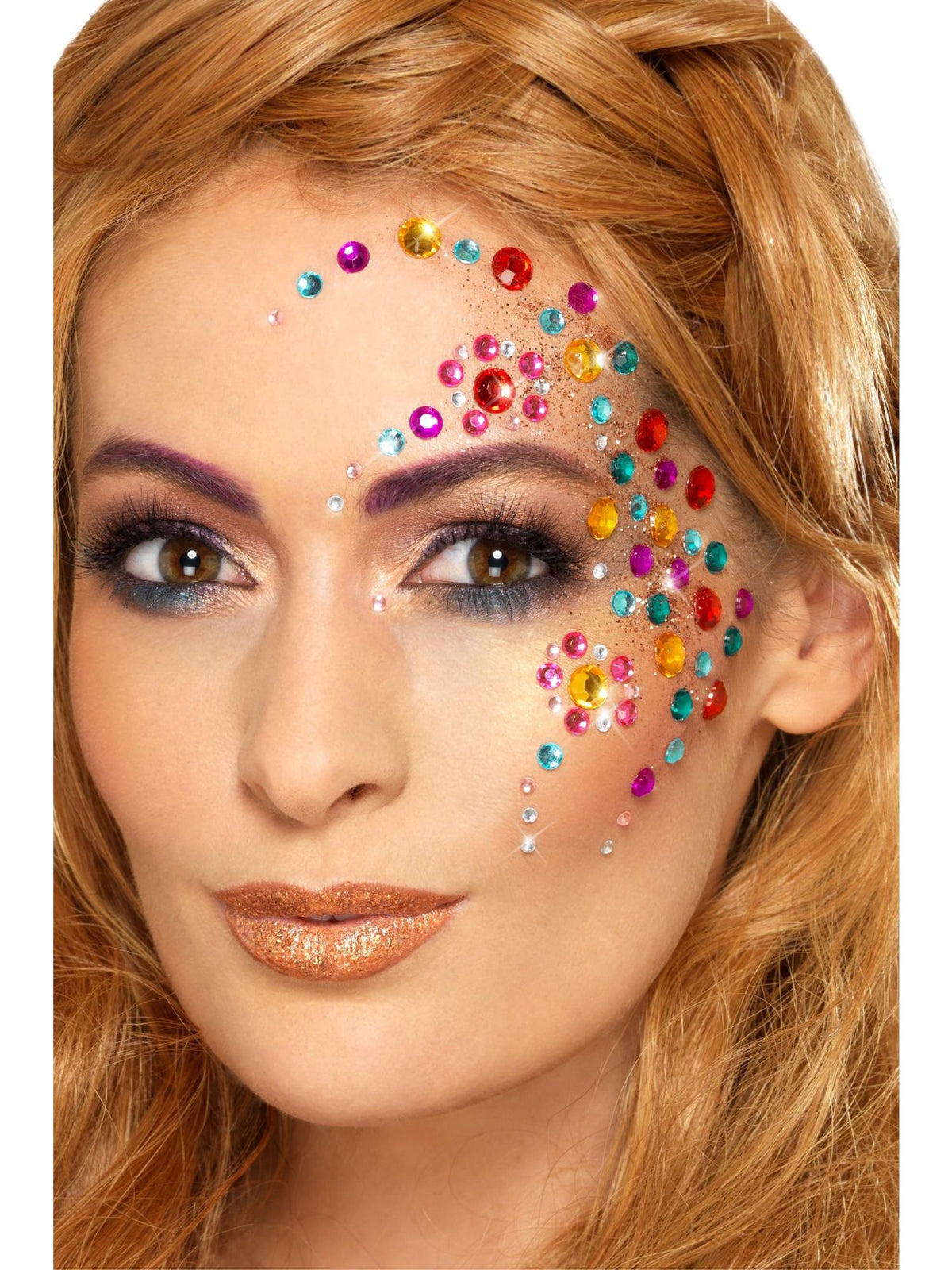 Woman wearing rainbow jewel face gems arranged around one eye