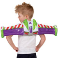 Back view of a boy wearing the purple, green and white Buzz Lightyear inflatable wings