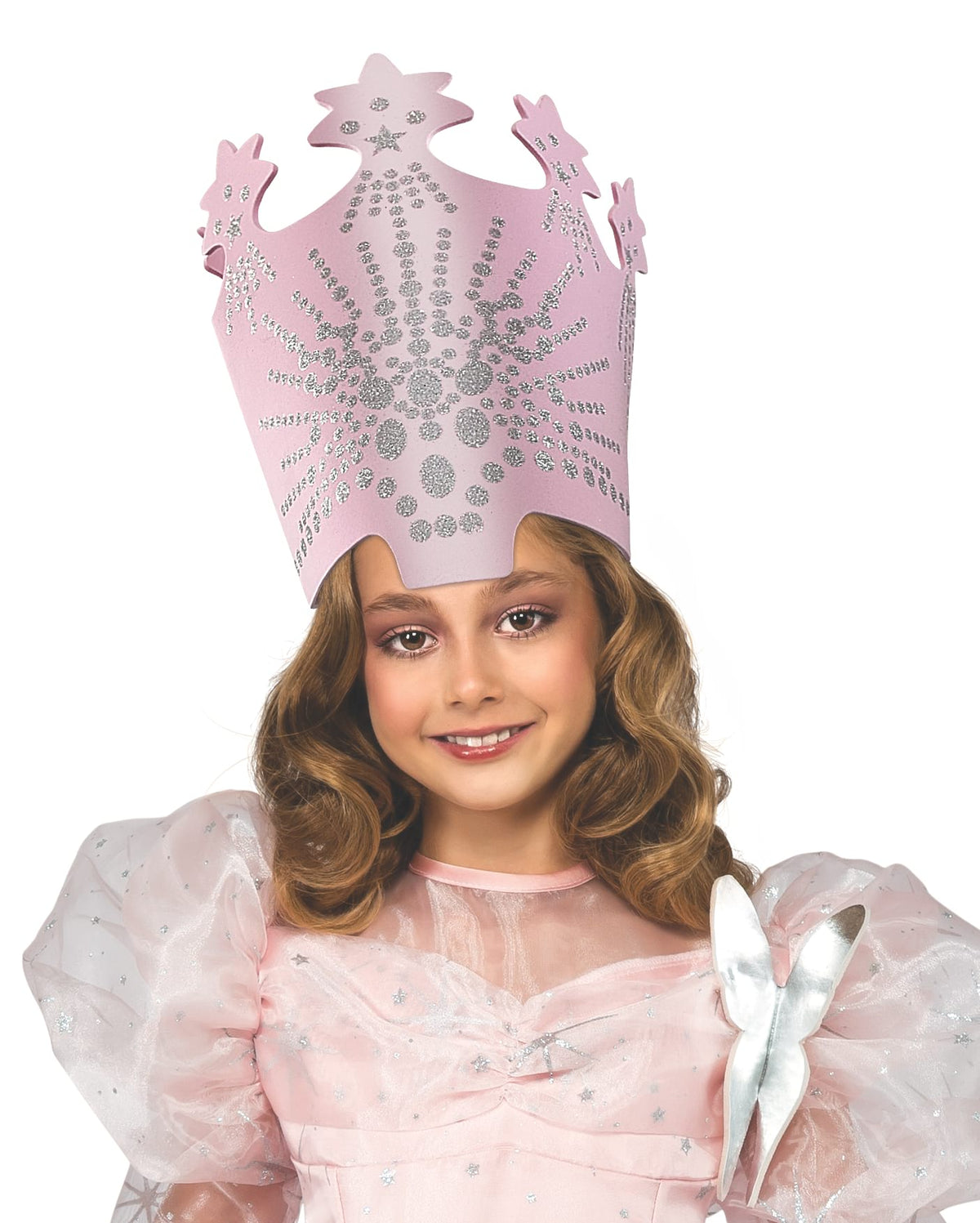 Girl wearing the tall pink Glinda crown with silver jewels
