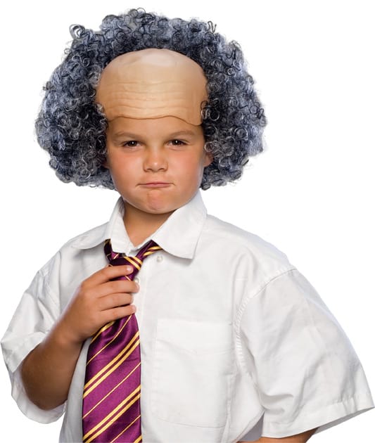 Boy wearing a bald cap wig with curly grey hair around the sides