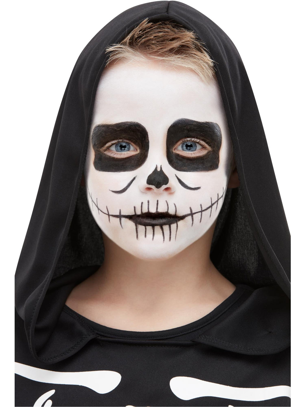 Child with white and black skeleton face paint created with the kit