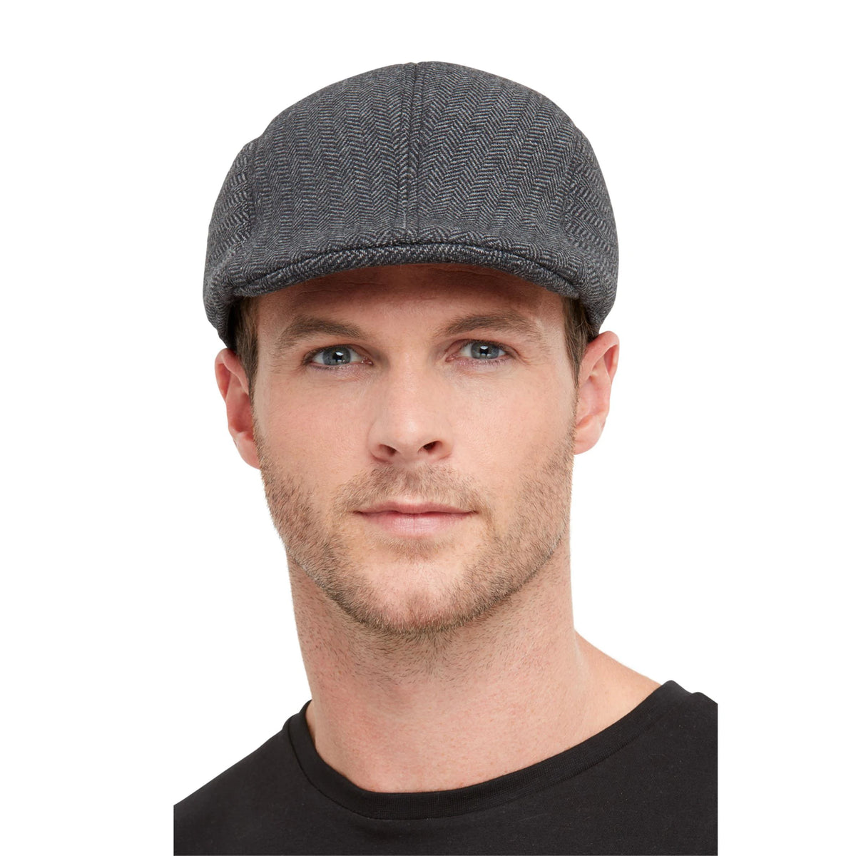 Man wearing a grey tweed-look gangster flat cap