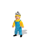 Toddler in the Minions Kevin yellow and blue fleece jumpsuit with goggle headpiece and faux hair