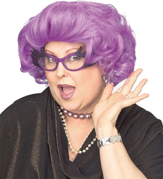 Woman wearing a short thick wavy bright purple wig