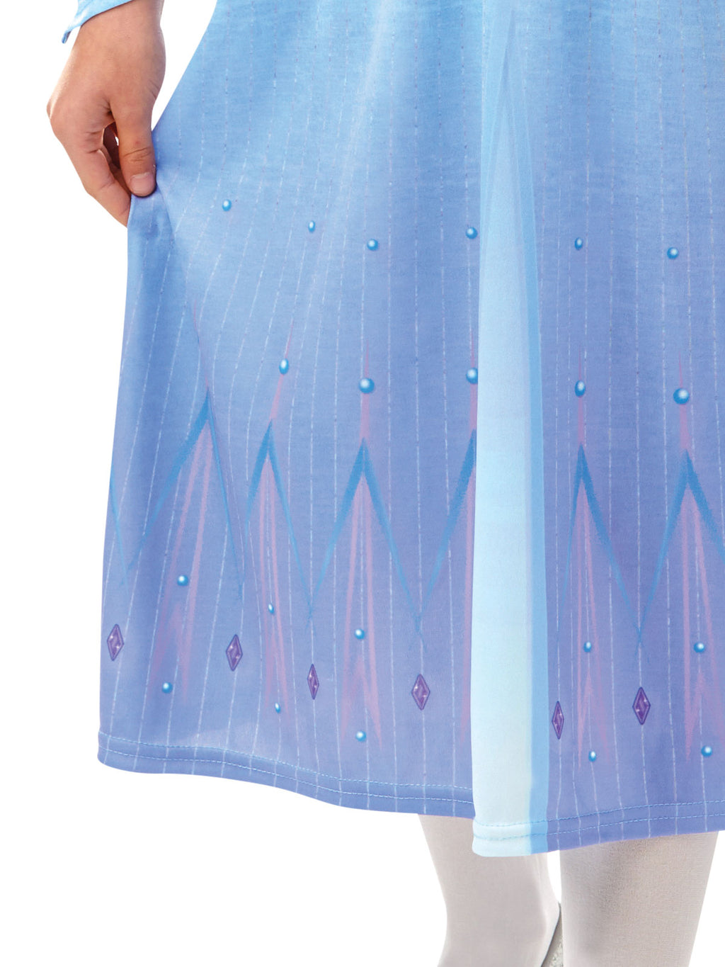 Close-up of the Elsa dress's printed blue skirt hem