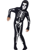 Child in a black hooded skeleton onesie with white bone print from head to toe