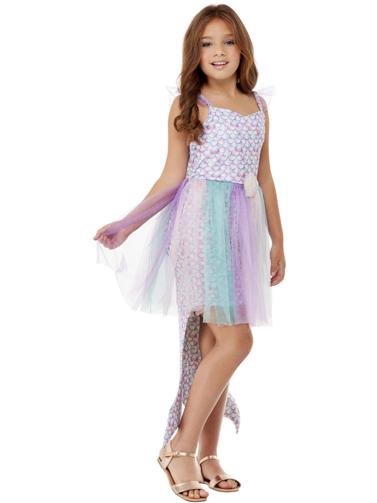 Side view of a girl in the seashell mermaid dress showing the attached mermaid tail