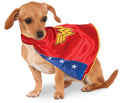 Small dog wearing the red satin Wonder Woman pet cape with gold logo and blue star underside