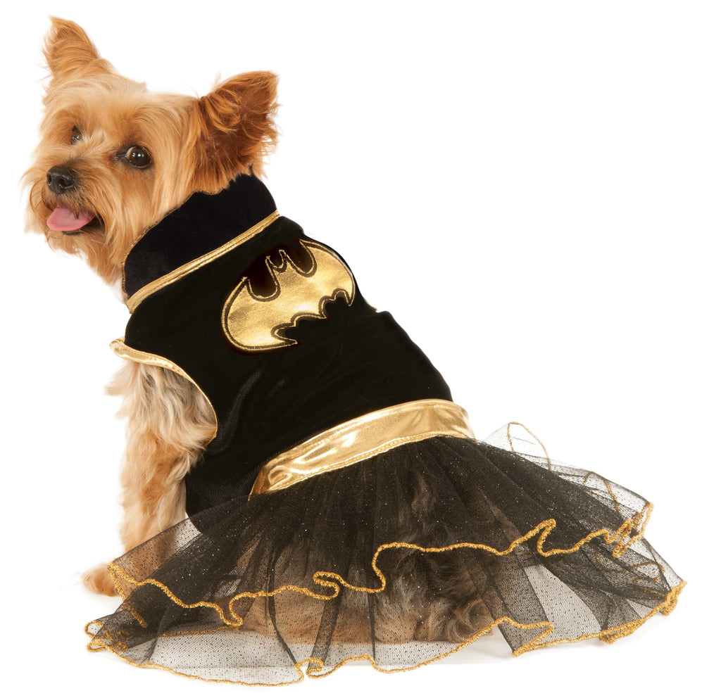 Small dog wearing the Batgirl pet tutu dress, black satin bodice with gold bat symbol and gold-edged tutu
