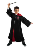 Boy in the Harry Potter Gryffindor Deluxe robe, black with a red satin-lined hood and House crest