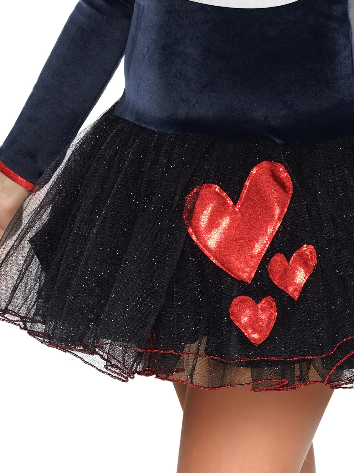 Close-up of the Pepe Le Pew black glitter tulle skirt with red sequin hearts