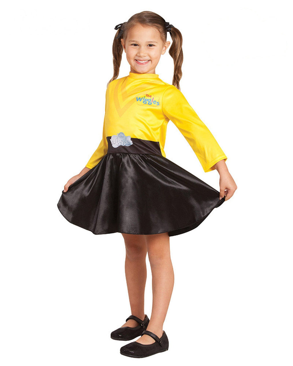 Girl in the Yellow Wiggle dress with a yellow top and black satin skirt, twirling