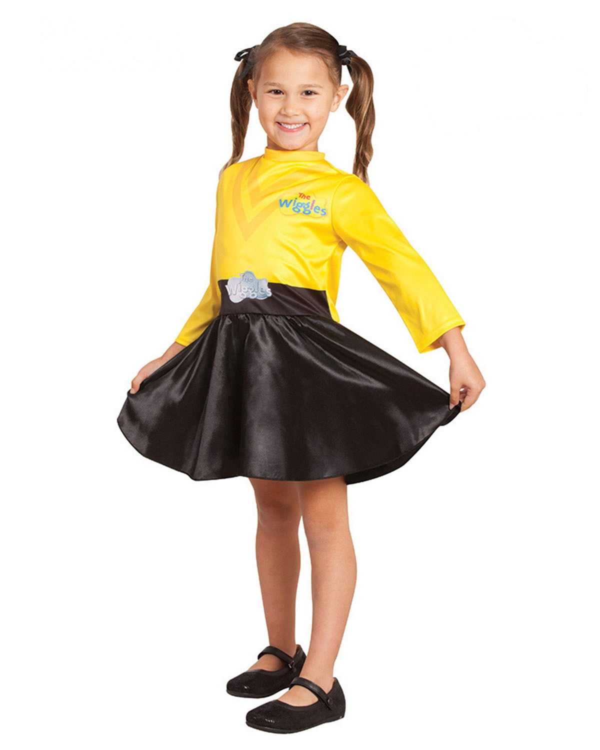 Girl in the Yellow Wiggle dress with a yellow top and black satin skirt, twirling