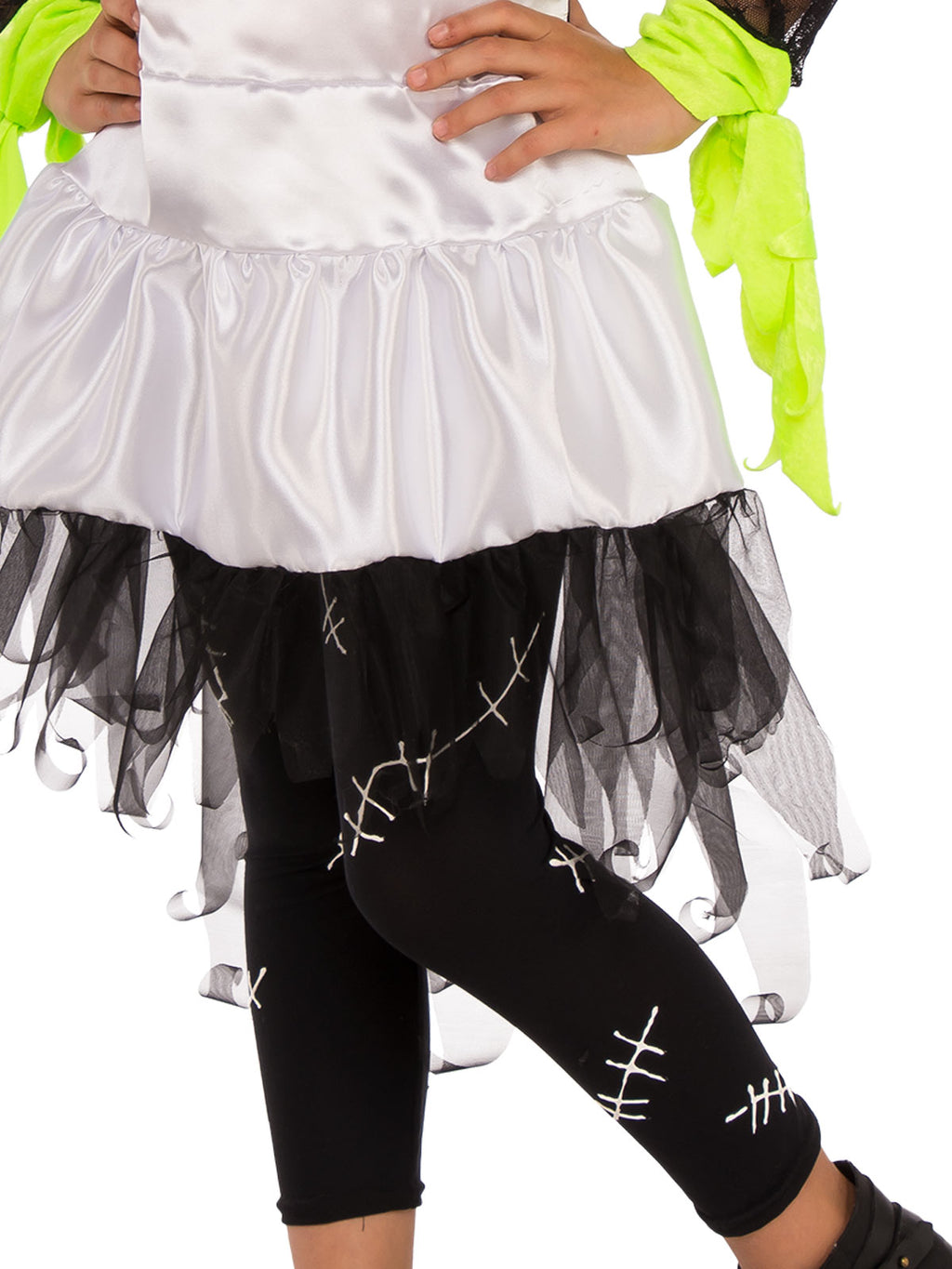 Close-up of the Monster Bride white satin skirt with black tulle frill and black scar-print tights