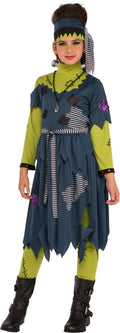 Teen girl in the Franny Stein monster costume, tattered teal patchwork dress, green sleeves, leggings and headband