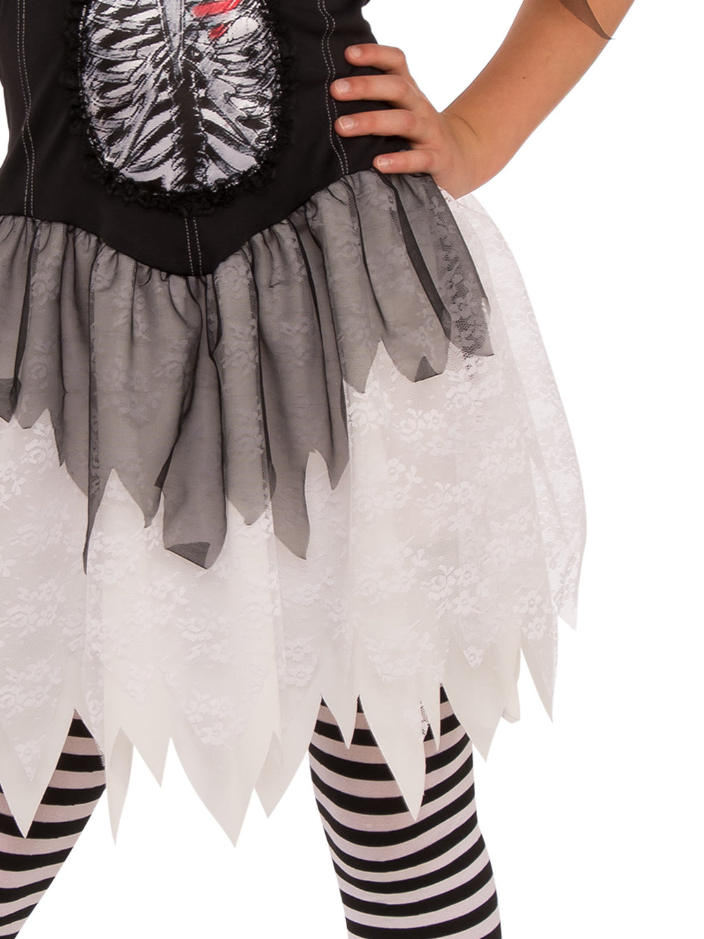 Close-up of the Open Ribs dress's tattered white and grey tulle skirt