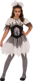 Teen girl in the Open Ribs skeleton costume, white tattered dress with ribs panel, striped leggings and lace headband