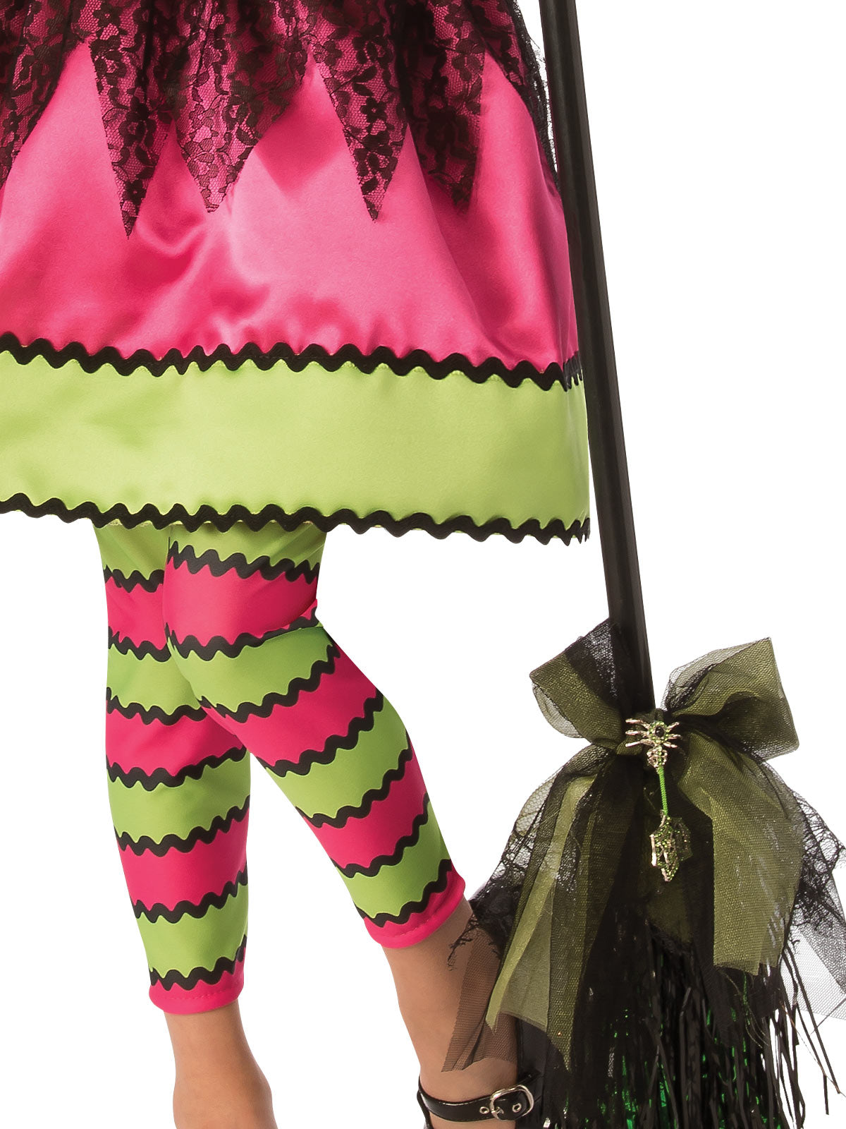Close-up of the bright witch skirt's zigzag hem and pink and green striped tights