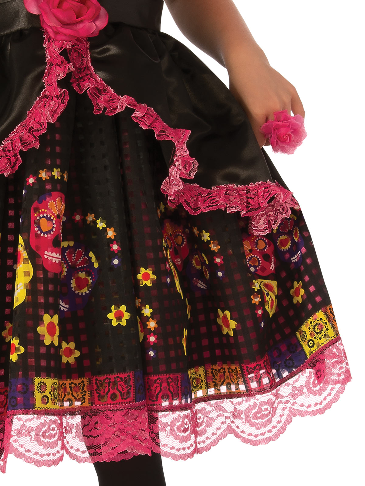 Close-up of the Day of the Dead dress's printed skirt with pink lace trim