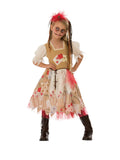 Girl wearing a voodoo doll dress with patchwork skirt, puff sleeves, tulle trim and skull hair piece headband