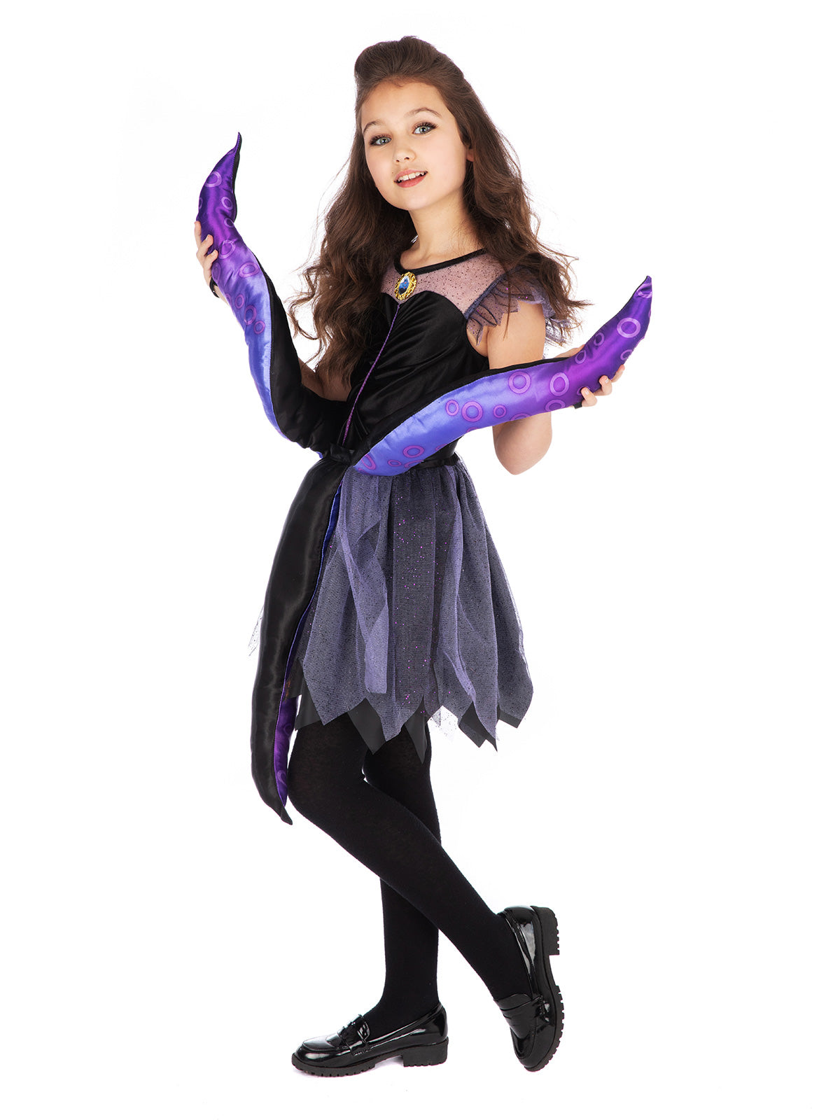 Girl posing in the Ursula dress, holding up the purple satin tentacles by their wrist loops