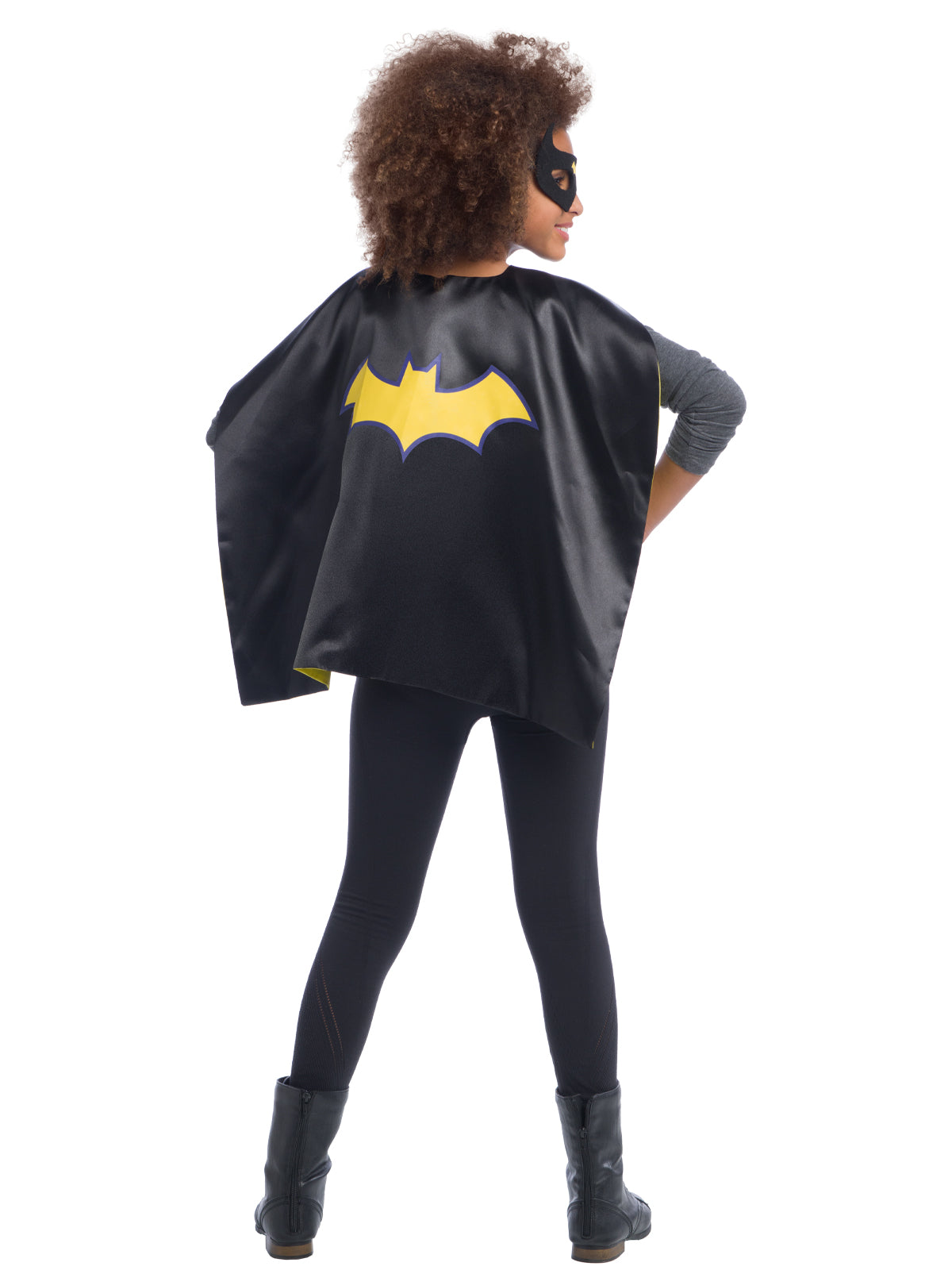 Back view of a girl wearing the black Batgirl cape with yellow bat logo